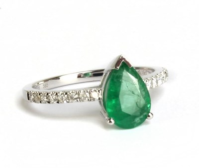 Lot 87 - A 14ct white gold emerald and diamond ring,...