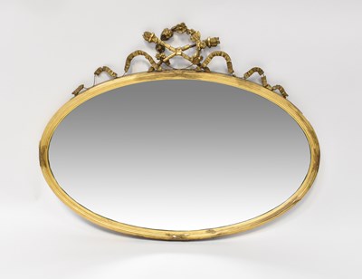 Lot 117 - An oval gilt framed wall mirror, with laurel...