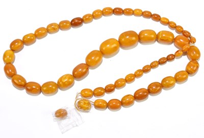 Lot 238 - A strand of butterscotch/egg yolk coloured...