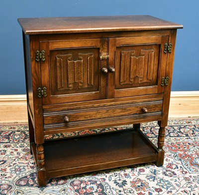 Lot 2574 - A reproduction oak cupboard