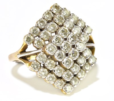 Lot 34 - An Indian yellow metal and diamond set ring of...