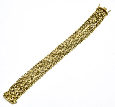 Lot 170 - A yellow metal mesh link bracelet stamped...