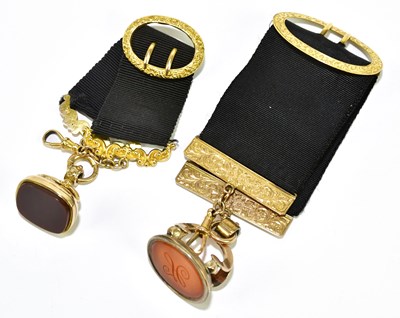 Lot 353 - Two 19th century yellow metal framed fobs...
