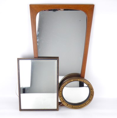 Lot 51 - A G-Plan style teak wall mirror of tapered form