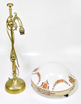 Lot 2350 - A decorative brass table with arched arm and...