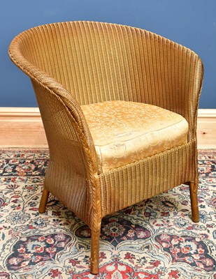 Lot 2484 - A gilt painted Lloyd Loom style chair.