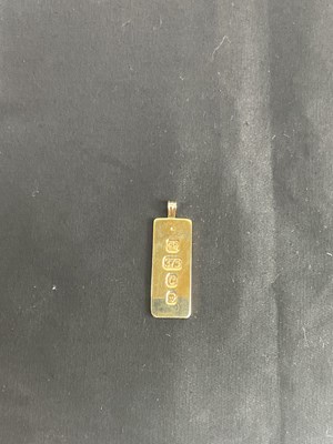 Lot 236 - A 9ct yellow gold ingot of rectangular form,...