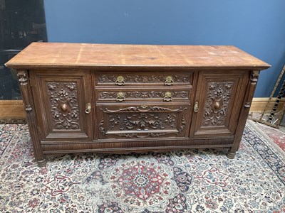 Lot 2443 - A late 19th century carved oak sideboard, with...