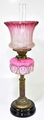Lot 2320 - A Victorian oil lamp with cranberry and clear...