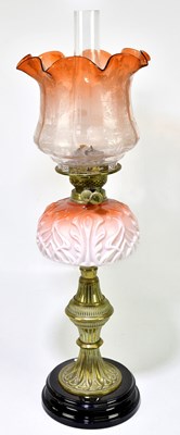 Lot 2340 - A Victorian oil lamp, the clear and cranberry...