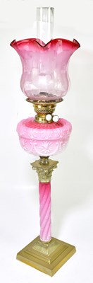 Lot 2321 - A Victorian oil lamp, with cranberry and clear...