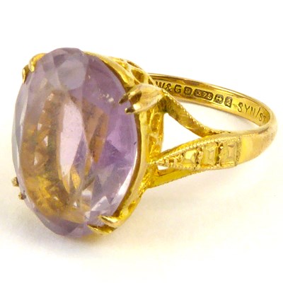 Lot 1008 - A 9ct gold amethyst dress ring, the claw set...