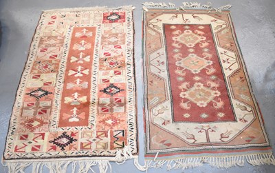 Lot 96 - Two hand knotted red/cream ground rugs, approx...