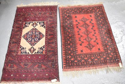 Lot 100 - Two hand knotted red ground rugs, 136 x 91cm...