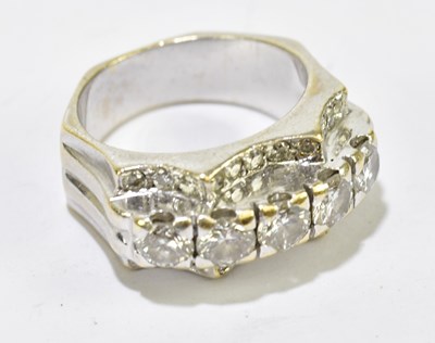 Lot 31 - A white metal diamond ring with five raised...