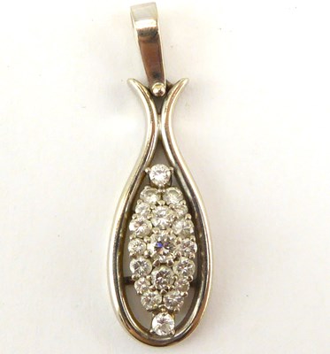 Lot 1064 - A white gold and diamond necklace pendant,...