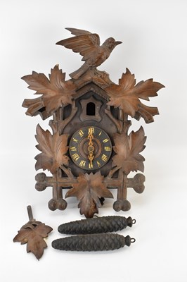 Lot 158 - A cuckoo clock with acorn weights.