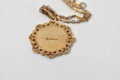 Lot 751 - A 9ct gold pendant on yellow metal chain,...