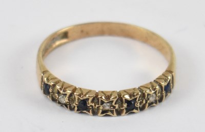 Lot 779 - A yellow metal stone set dress ring, rubbed...