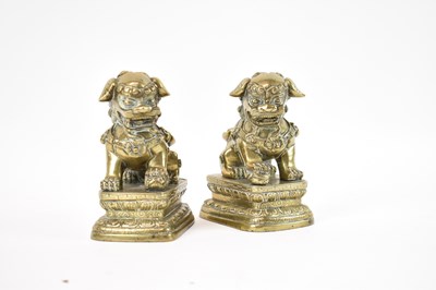 Lot 594 - A pair of Chinese polished bronze figures of...