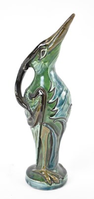 Lot 421 - C H BRANNAM; a pottery ewer modelled as a bird,...