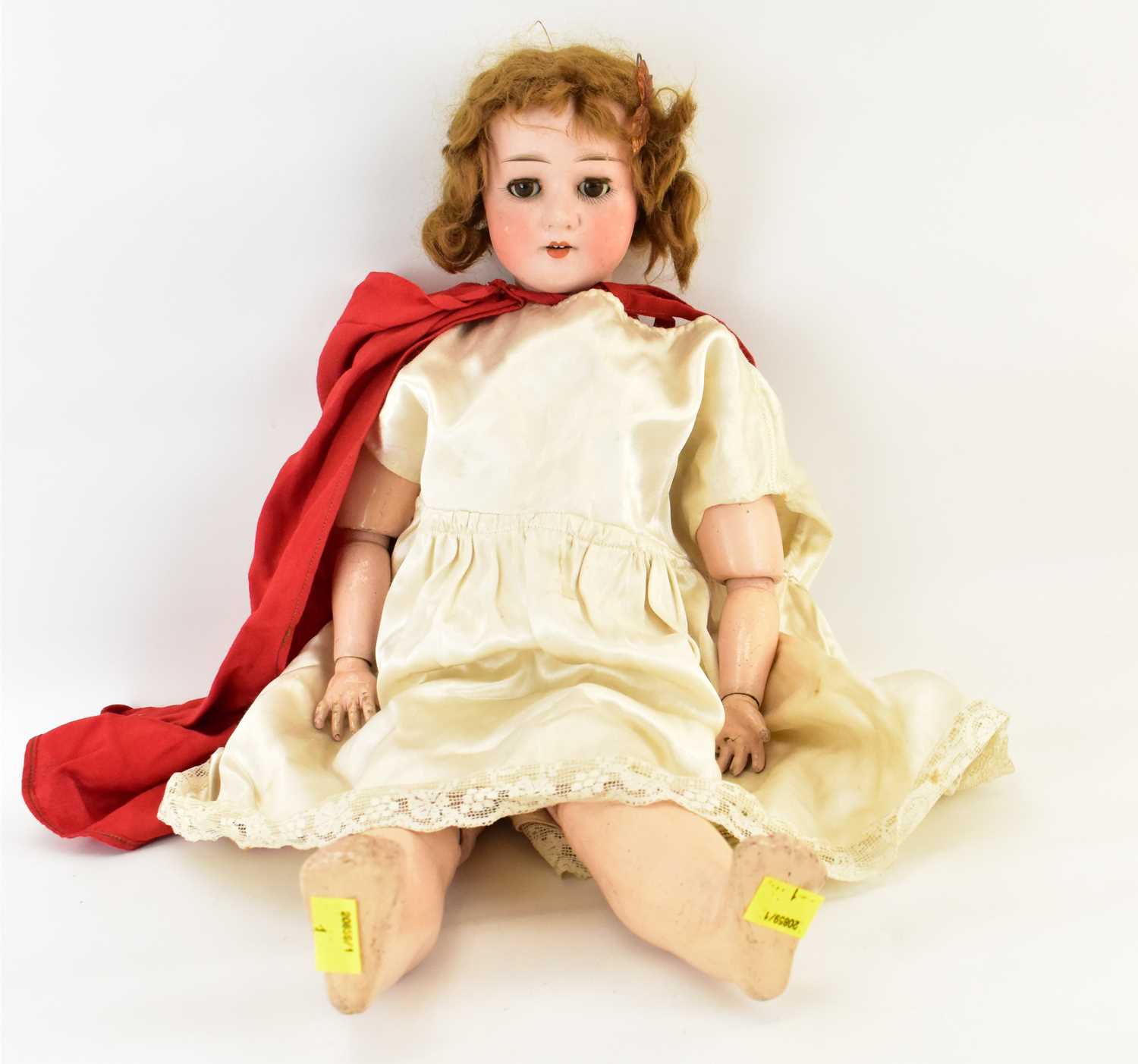 Lot 386 - A 19th century German porcelain doll, the head...