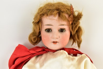 Lot 386 - A 19th century German porcelain doll, the head...