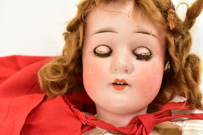 Lot 386 - A 19th century German porcelain doll, the head...