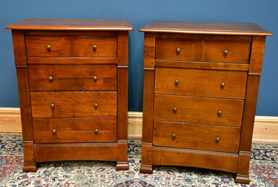 Lot 2597 - A modern pair of four drawer chests raised on...