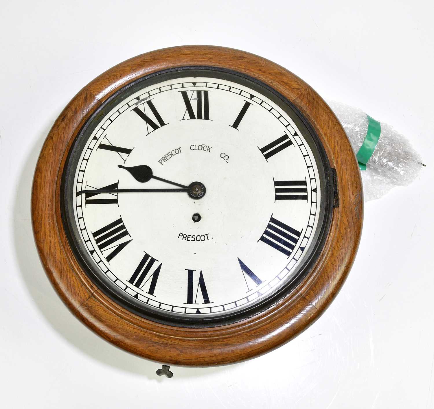 Prescot Clock Image Lot 2290 - A circa 1900 oak circular wall clock with