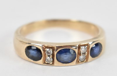 Lot 728 - An 18ct yellow gold diamond and sapphire ring,...