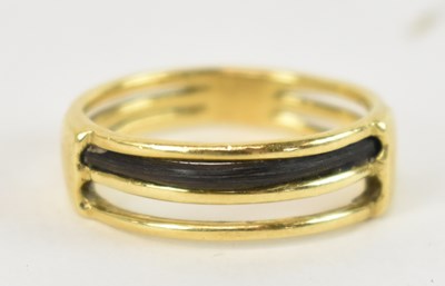 Lot 727 - An 18ct yellow gold ring, size O, approx. 4.6g.