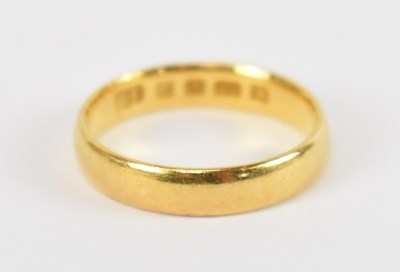 Lot 708 - A 22ct yellow gold wedding band, size L,...