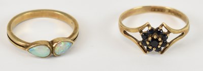 Lot 776 - A 9ct yellow gold ring set with two small...