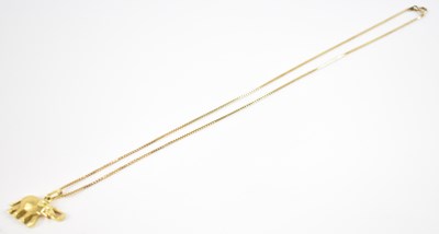 Lot 700 - An 18ct yellow gold pendant modelled as an...