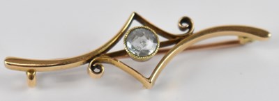 Lot 686 - A 15ct yellow gold brooch set with central...