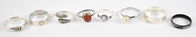 Lot 821 - A group of seven hallmarked silver dress rings,...