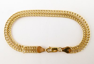 Lot 1032 - A 9ct gold double-strand bracelet with lobster...