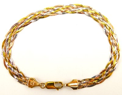 Lot 1033 - A 9ct gold three-colour woven strand bracelet,...