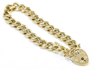 Lot 522 - A 9ct yellow gold curb link bracelet with...