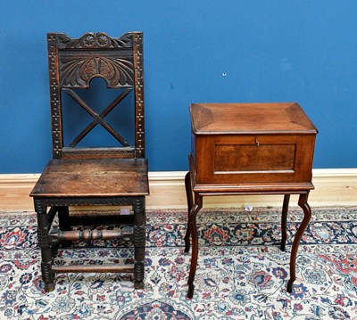 Lot 2447 - An 18th century oak hall chair with carved...