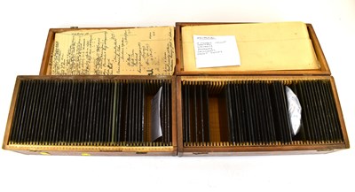 Lot 702 - Two wooden boxes of glass negative slides, to...