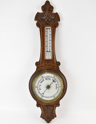 Lot 161 - An early 20th century oak cased barometer of...