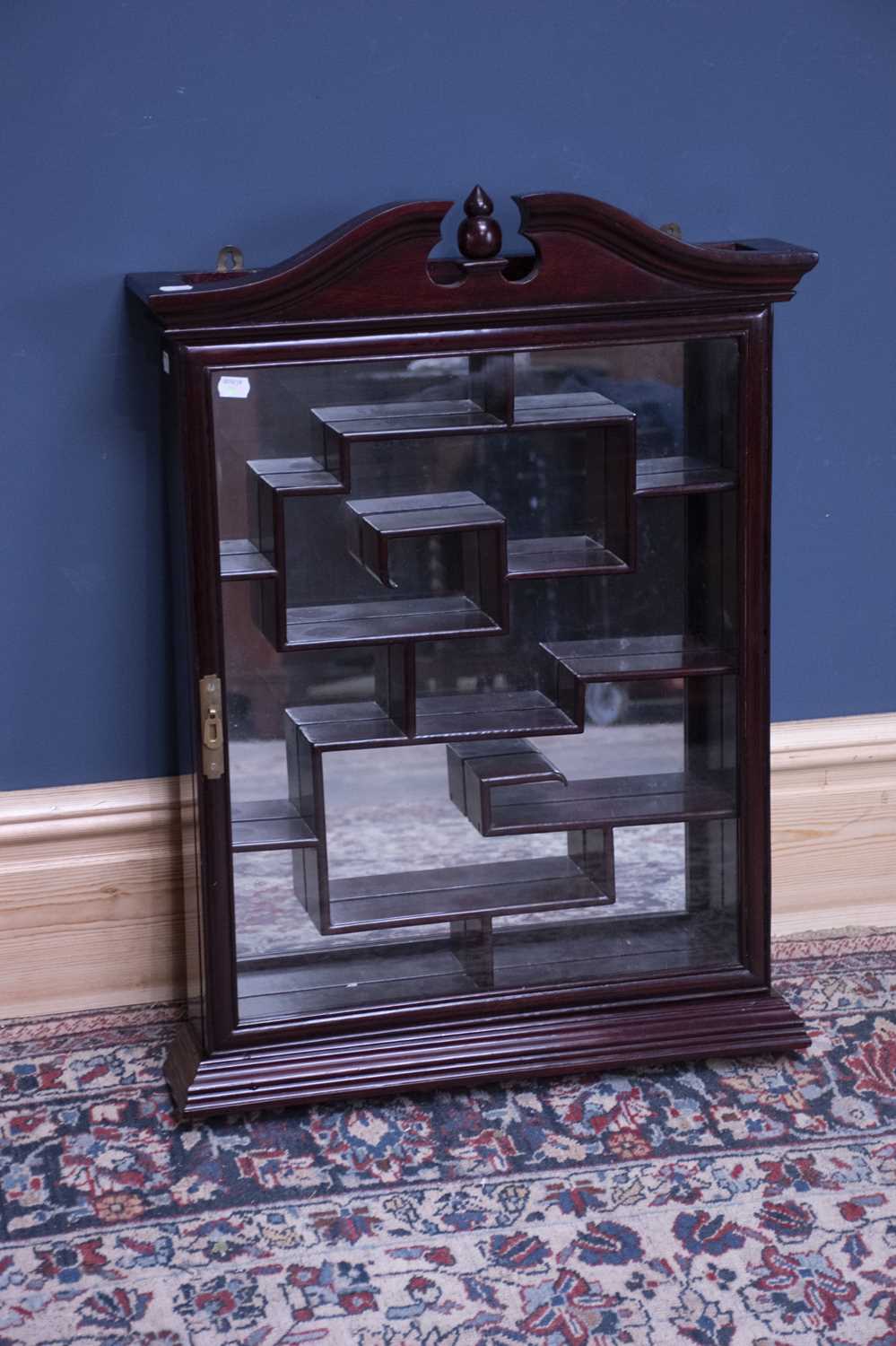 Lot 2526 - A Chinese hardwood wall mounted display...