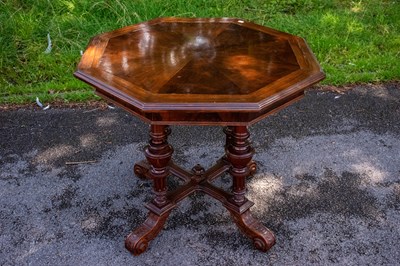 Lot 2394 - A Continental walnut octagonal centre table,...