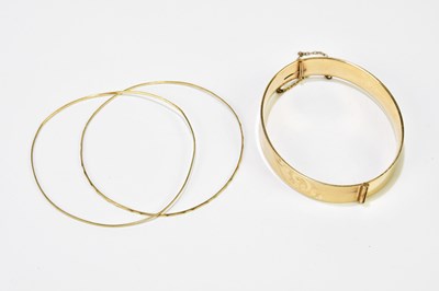 Lot 554 - Two 15ct yellow gold very thin fine bangles,...