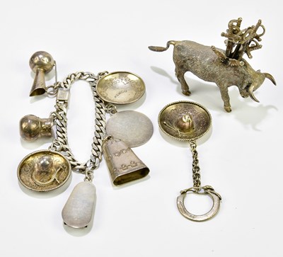 Lot 769 - A Mexican silver charm bracelet set with...