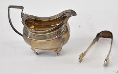 Lot 638 - A George III hallmarked silver cream jug,...