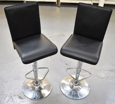 Lot 72 - A pair of modern bar stools with chrome bases.