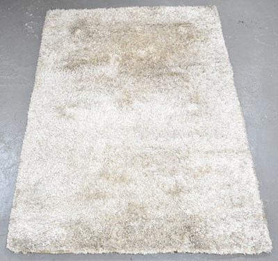 Lot 99 - A modern deep pile carpet.